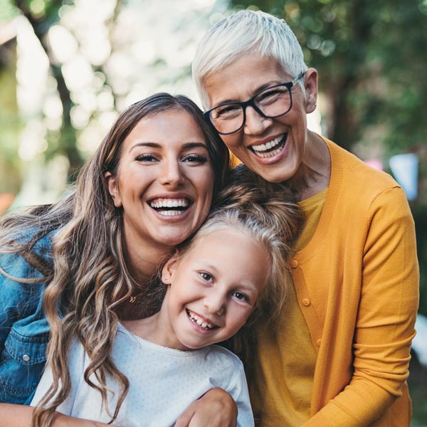 three generations of women smiling