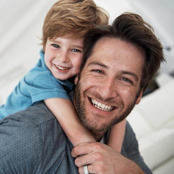 smiling father and son